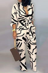 Abstract Print Long Sleeve Belted Jumpsuit